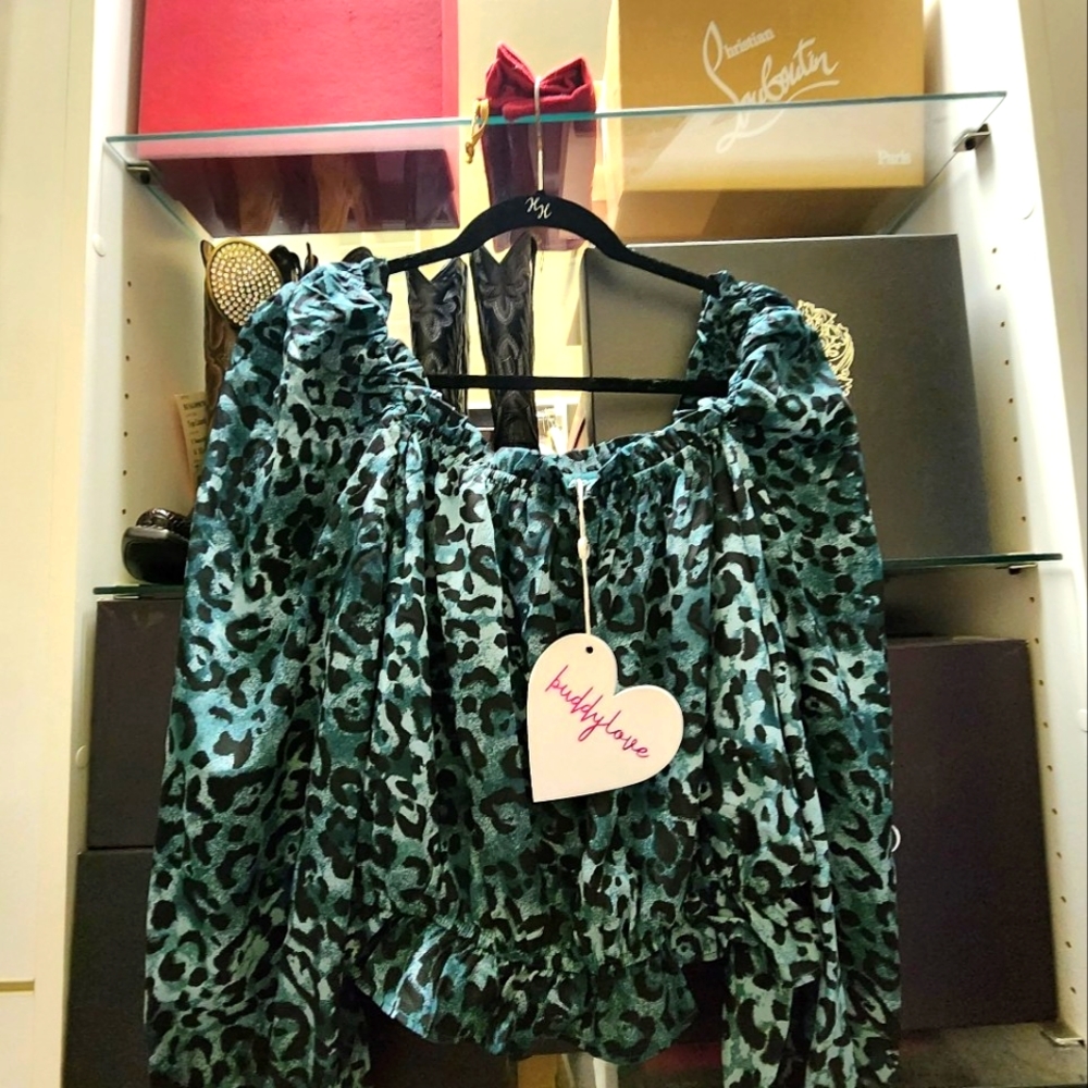 Brand New beautiful animal print off the shoulder blouse. I